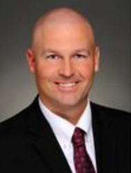The Hon. John Schmude